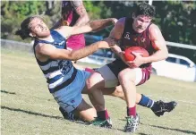  ??  ?? Simon Callahan is reeled in by Broadbeach’s Luke Dempsey-Ceh.