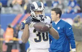  ?? Bill Kostroun Associated Press ?? TODD GURLEY has scored a league-leading 10 touchdowns for a Rams team that leads the NFL in scoring, averaging nearly 33 points a game.