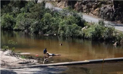  ?? Photograph: Blake Sharp-Wiggins/The Guardian ?? ▲ People try to cool off at the Jelly Bean Pools near Glenbrook, west Sydney, as temperatur­es across the country rise.