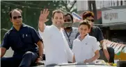  ?? — PTI ?? Congress vice-president Rahul Gandhi waves during his road show in Gujarat’s Valsad district on Friday.