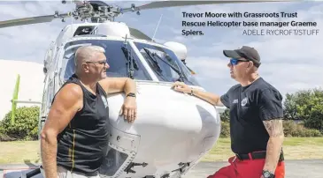  ?? ADELE RYCROFT/STUFF ?? Trevor Moore with Grassroots Trust Rescue Helicopter base manager Graeme Spiers.