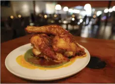  ?? ?? The Mary's half chicken al carbon with chili butter, salsa matcha and cilantro zhoug is served at Oculto in the Castro Valley Marketplac­e.