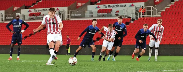  ?? Pictures: Phil GREIG/SCFC ?? SPOT ON:
Emre Tezgel slots home a penalty during Stoke City Under-21s victory over Hertha Berlin on Tuesday night. Below: Manager Kevin Russell.