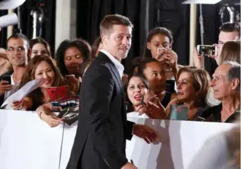  ?? JONATHAN LEIBSON/GETTY IMAGES ?? Brad Pitt, in Westwood, Calif., on Wednesday — his first red carpet appearance since his divorce was announced.