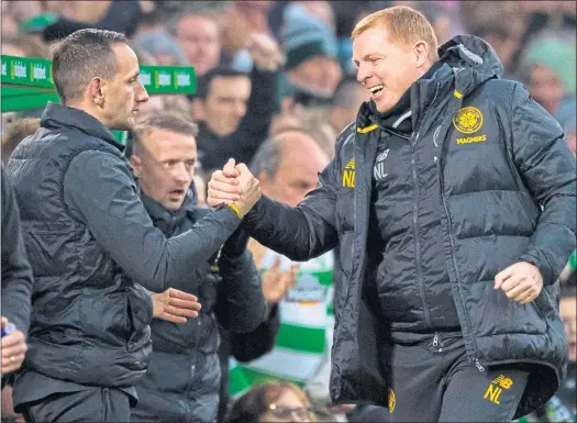  ??  ?? Neil Lennon celebrates with John Kennedy during yesterday’s 4-0 win over Livingston, with the returning Leigh Griffiths in the background