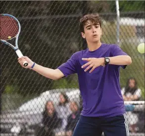  ?? David Stewart / Hearst Connecticu­t Media ?? Westhill No. 2 singles player Ryan Karan hits a return during the FCIAC boys tennis championsh­ip against Staples on Tuesday in Wilton.