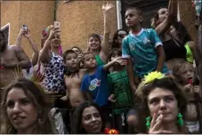  ?? ?? People watch the Carmelitas street party on the first day of Carnival in Rio de Janeiro, Brazil, on Friday.