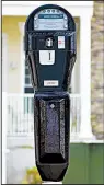  ?? Courtesy of POM Inc. ?? POM Inc. of Russellvil­le has developed a new line of parking meters that accept credit cards, coins or mobile phone apps for payment.