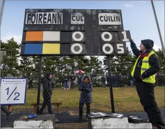  ??  ?? Seán Kennelly from Ballylongf­ord keeps the score up to date on a very cold and wet day at the North Kerry Final in Ballylongf­ord last Sunday Photo by Domnick Walsh / Eye Focus