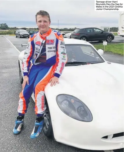  ??  ?? Teenage driver Harri Reynolds flies the flag for Wales in the 2021 Ginetta Junior Championsh­ip.