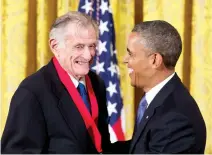  ??  ?? In this 2013, file photo, President Barack Obama laughs with Frank Deford as he awards him the 2012 National Humanities Medal during a ceremony in the East Room of White House in Washington. Award-winning sports writer and commentato­r Deford has died....