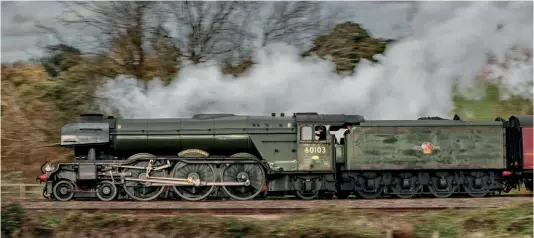  ?? ?? The National Railway Museum’s LNER A3 No. 60103 Flying Scotsman speeds past Hatton North Junction as it accelerate­s away from a scheduled pathing stop in Hatton Down goods loop at the head of the 5Z75 7.05am Swanage to Bury (East Lancashire Railway) light engine move after departing the Purbeck line on November 8. GRAHAM NUTTALL