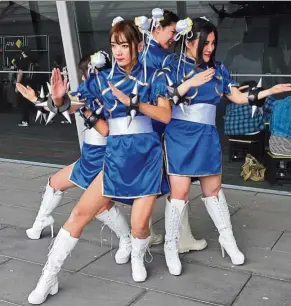  ??  ?? The venerable Streetfigh­ter video game franchise – more than 20 years old – still has a loyal following of Chun-Li cosplayers from among GenYers.