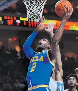  ?? Sam Wasson Getty Images ?? CODY RILEY puts up a shot against North Carolina in Friday’s consolatio­n game of the Las Vegas Invitation­al. Riley had 11 points and nine rebounds off the bench.