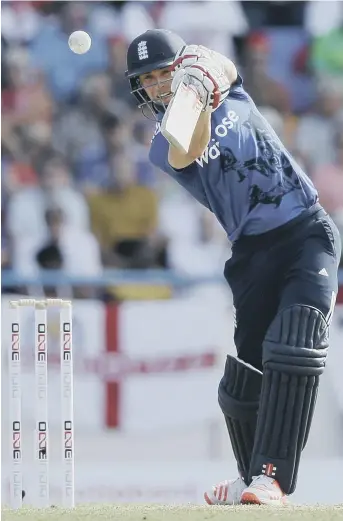  ??  ?? Chris Woakes hits out on his way to a match-winning 68 not out against the West Indies last night