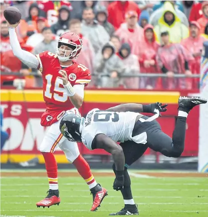  ??  ?? Chiefs quarterbac­k Patrick Mahomes, left, throws a pass against the Jaguars last Sunday.