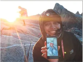  ??  ?? Hiba might not have been able to climb Mount Kinabalu with him in 2015, but Fareez made sure he shared his summit moment with her.