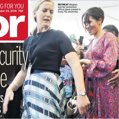  ??  ?? RETREAT Meghan and her protection officer leave market in Suva, Fiji, yesterday