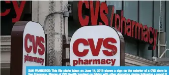  ??  ?? SAN FRANCISCO: This file photo taken on June 14, 2015 shows a sign on the exterior of a CVS store in San Francisco. Shares of CVS Health tumbled on Friday with other drugstore chains following a report it could acquire insurer Aetna to fortify itself...