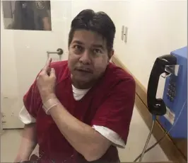  ?? AP file photo ?? Escaped state hospital patient Randall Saito points to a guard as he sits in an inmate visitor’s booth at San Joaquin County Jail before a scheduled court hearing in French Camp, Calif., last month. U.S. marshals brought Saito back to Hawaii earlier...