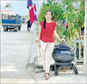  ?? SUPPLIED ?? *Eco-Bin founder Soeurng Sothavy poses with one of her bins in Kampong Cham.