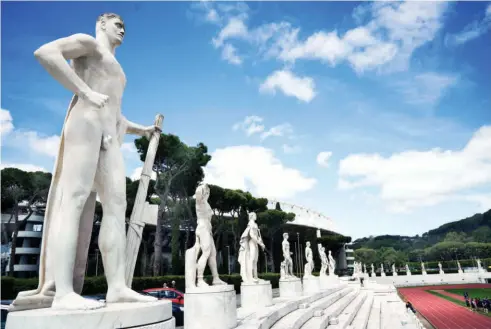  ?? ?? A MARBLE STATUE holding a fasces—a bundle of rods tied together around an axe—adopted by Italian dictator Benito Mussolini as a symbol of power, adorns the Stadio dei Marmi (‘Stadium of the Marbles’) in the sports complex, the Foro Italico, in Rome.