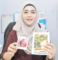  ??  ?? ERIYANA bersama gambar suami yang sentiasa berada di pejabatnya.