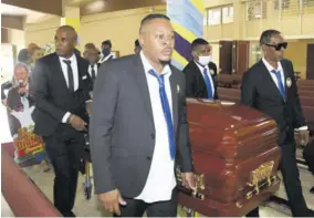  ?? ?? Pall-bearers exit Boulevard Baptist Church with the body of the late Fitzroy Simpson “Bunny Diamond’ at the thanskivin­g service.