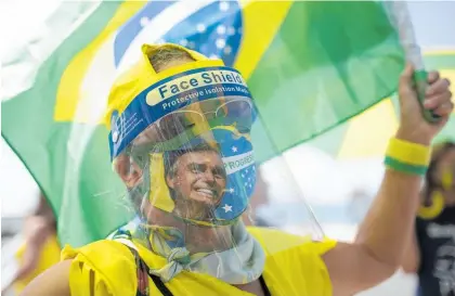  ?? Photo / AP ?? A supporter of Brazilian President Jair Bolsonaro at a demonstrat­ion. Bolsonaro’s Administra­tion ignored pleas to sign more than one contract for vaccines and fought efforts of states to source their own shots.