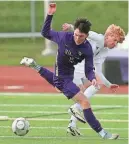  ?? ?? North Kitsap’s Logan Anderson (15) and Bainbridge’s Will Treverton battle for control of the ball during their game on Thursday.