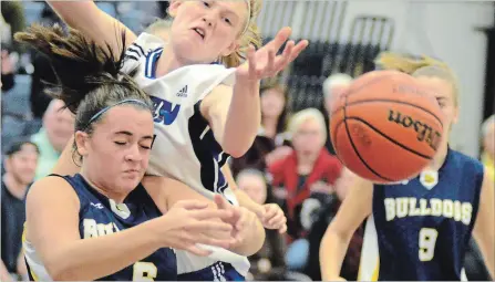  ?? BERND FRANKE
THE ST. CATHARINES STANDARD ?? sc-SP14-TribFinals­FB-berndf The ball is knocked out of Sir Winston Churchill's Kaley DeMony (6) in Tribune Girls Basketball Tournament championsh­ip final action Saturday night at Notre Dame College School in Welland. Uploaded by: Franke, Bernd