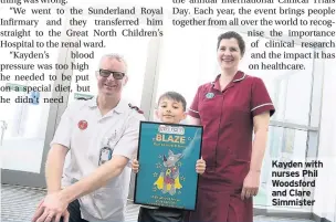  ??  ?? Kayden with nurses Phil Woodsford and Clare Simmister