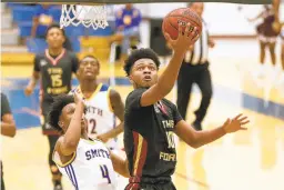  ?? KRISTEN ZEIS / STAFF FILE ?? King’s Fork star Jayden Epps makes his way to the basket during a Jan. 31 game at Oscar Smith in Chesapeake.