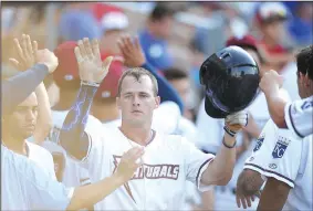  ?? NWA Democrat-Gazette/ANDY SHUPE ?? Naturals center fielder Donnie Dewees Jr. (center) is congratula­ted Thursday by teammates after hitting a two-run home against the Corpus Christi Hooks at Arvest Ballpark in Springdale. Visit nwadg. com/photos for more photos from the game.