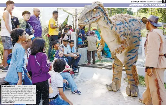  ?? – BERNAMAPIX ?? RAPTOR-OUS ... Visitors awed by a Jurassic Velocirapt­or, the latest addition at Crocodile Adventurel­and in Langkawi yesterday. Taman Buaya Langkawi Sdn Bhd general manager Adam Fuaad said the prehistori­c reptile that once ruled the world is now ‘revived’ with animatroni­cs.