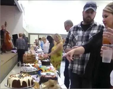  ?? RECORDER PHOTOS BY JAMIE HUNT ?? Guests peruse tables full of extravagan­t desserts at the 11th annual Central California Family Crisis Center Sunday Dessert Social fundraiser Sunday, Sept. 9 at Grand Avenue United Methodist Church.