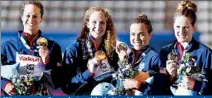  ??  ?? US team pose for a photo with their gold medals at the women's 4x100m freestyle victory ceremony during the World Swimming Championsh­ips at the Sant Jordi arena in Barcelona July 28, 2013. From left Megan Romano, Shannon Vreeland, Natalie Coughlin and...