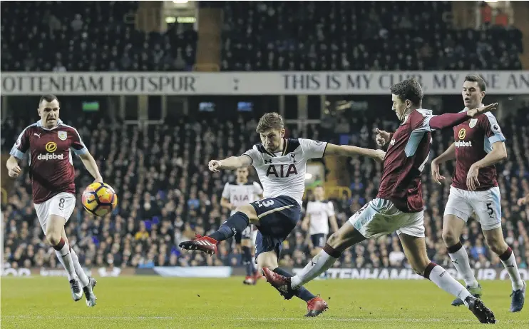  ?? — GETTY IMAGES ?? Tottenham Hotspur defender Ben Davies, centre, takes a shot during his team’s 2-1 victory over Burnley at White Hart Lane in London on Sunday.