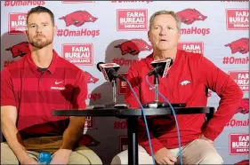  ?? NWA Democrat-Gazette/ANDY SHUPE ?? Matt Hobbs (left) was hired in November by Arkansas baseball Coach Dave Van Horn as the Razorbacks new pitching coach from Wake Forest. Hobbs likes to use technology in developing pitchers.