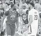  ?? KYLE TERADA/USA TODAY SPORTS ?? Draymond Green jaws with Pelicans forward Anthony Davis in Tuesday’s game.