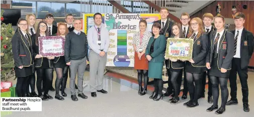  ??  ?? Partnershi­p Hospice staff meet with Braidhurst pupils