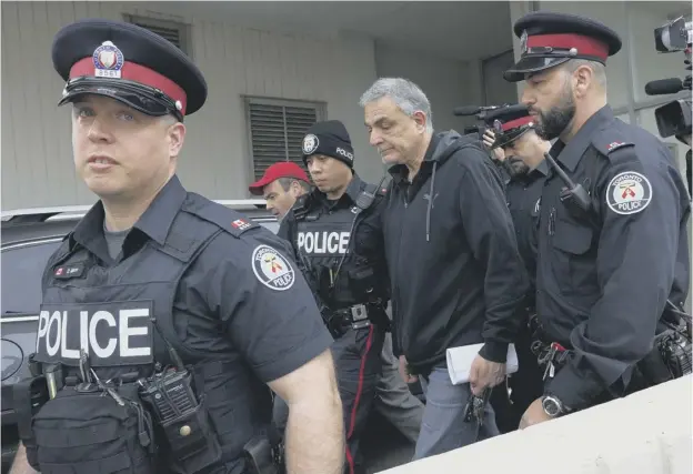  ??  ?? 0 Vic Minassian, the father of suspect Alek Minassian, leaves court after his son’s court appearance in Toronto