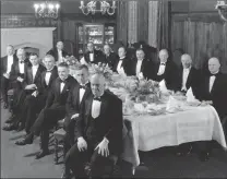  ?? Galt Archives photo 1975422602­3 ?? Photograph of 15 men in formal attire sitting down to dinner. Senator Buchanan is sitting on the far left in the second row. Circa 1925.
