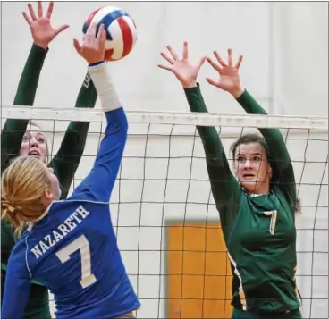  ?? SAM STEWART — DIGITAL FIRST MEDIA ?? Bishop Shanahan’s Tess Elder, left, and Alysa Wright rise up for the block during the first set against Nazareth.