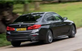  ??  ?? The 5 Series’s dynamic makeup is erring towards that of the 7 Series, but its rigidity, balance and feelsome steering render it satisfying when pushed on B-roads