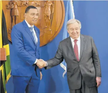  ?? (Photo: Joseph Wellington) ?? Prime Minister Andrew Holness (left) shakes hands with United Nations Secretary General Antonio Guterres at a joint news conference at Jamaica House in St Andrew on Monday.