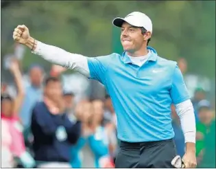  ?? PATRICK SMITH/GETTY ?? Rory McIlroy is pumped as he makes eagle on the eighth hole during the third round of the Masters.