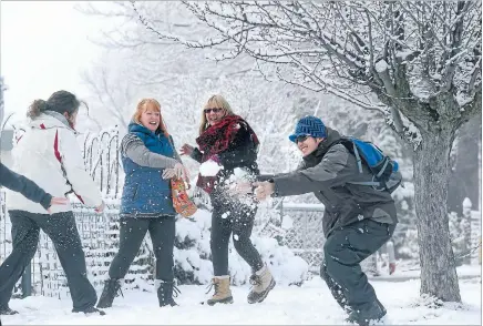  ?? Photo: JOHN BISSET/FAIRFAX NZ ?? Take that: Lake Tekapo experience­d snow overnight on Monday and, from left, Sally Kahl, Anne Petterson, Lynne Frost and James Cage decided to have some fun.