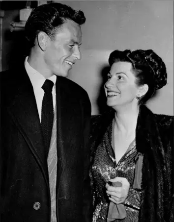  ?? Associated Press ?? Singer Frank Sinatra and his first wife, Nancy, are shown leaving a Hollywood night club on Oct. 23, 1946.