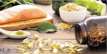  ?? Carlos Gaw/Getty Images ?? Foods that are rich in omega-3 include salmon, flax seeds, broccoli, sardines, spinach, olives and olive oil. Omega-3 rich foods can help lower your risk of heart disease by having an impact on triglyceri­des and blood pressure.